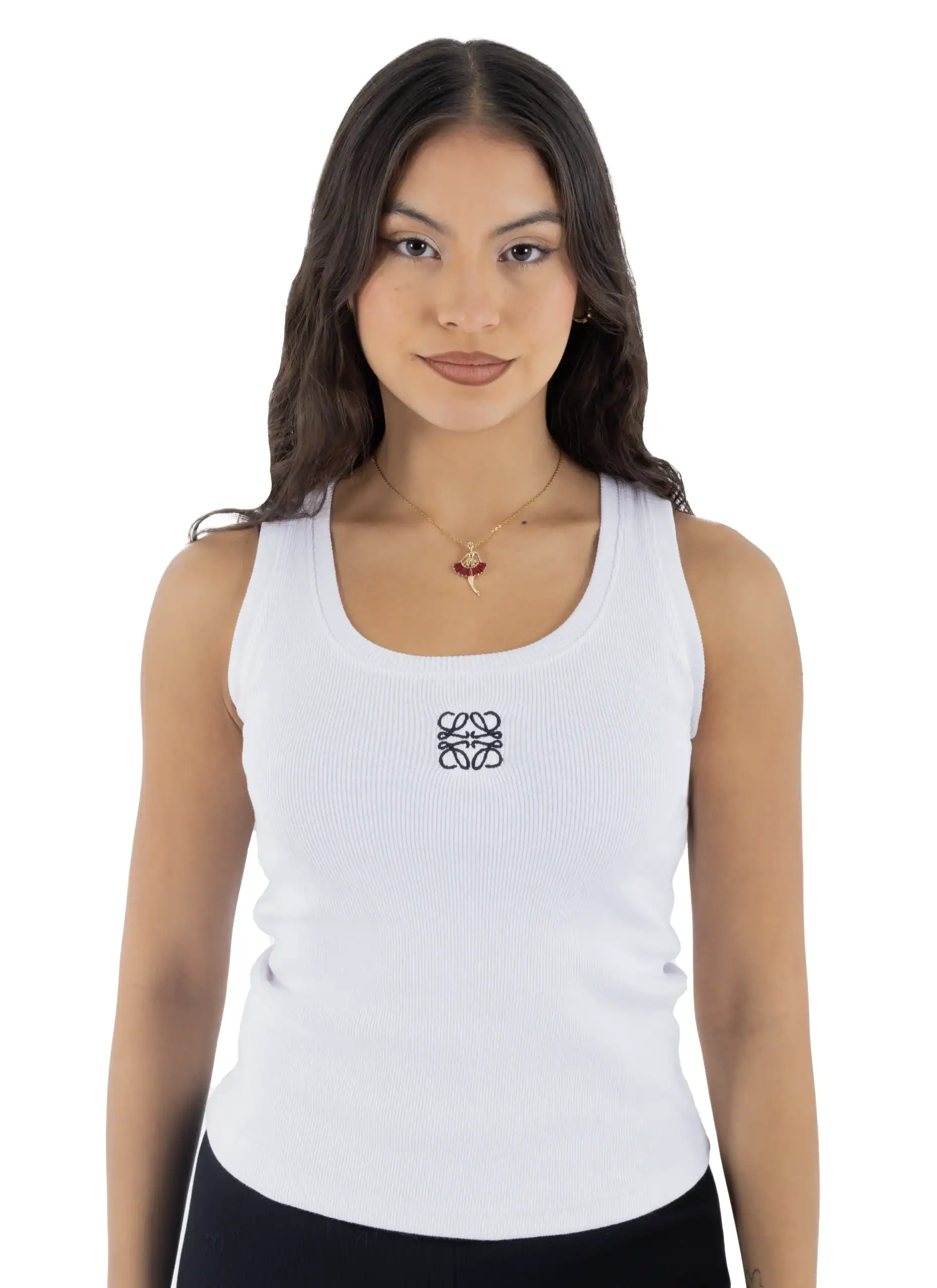 Young woman wearing a white Loewe tank top with logo, smiling confidently.